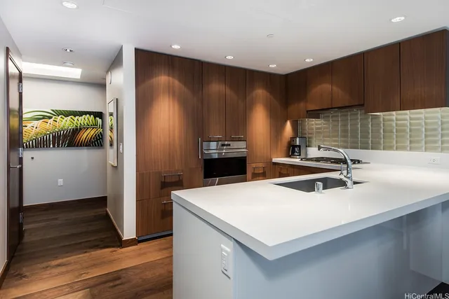 a kitchen with a refrigerator and a sink