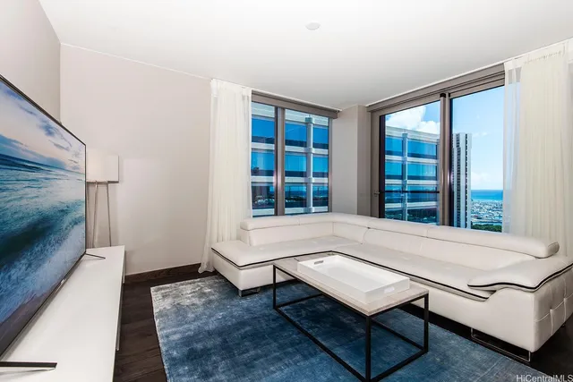 a living room with furniture a rug and a large window