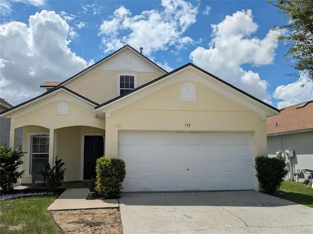 a view of a back yard of the house