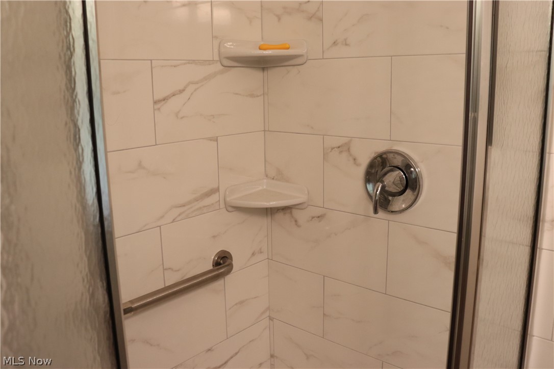 8407 Cedar Road Chesterland, OH 44026 - Photo 22 of 33 Tiled shower in master bath