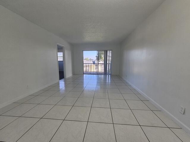 7910 North Colony Circle, Unit 301 Tamarac, FL 33321 - Photo 3 of 5 a view of an empty room and window