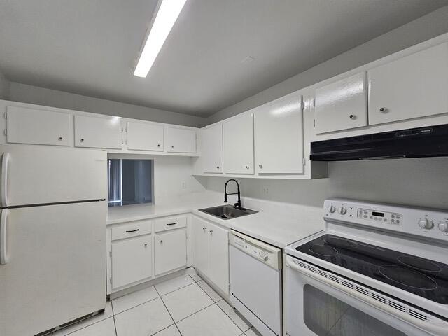 7910 North Colony Circle, Unit 301 Tamarac, FL 33321 - Photo 5 of 5 a kitchen with appliances a sink and cabinets