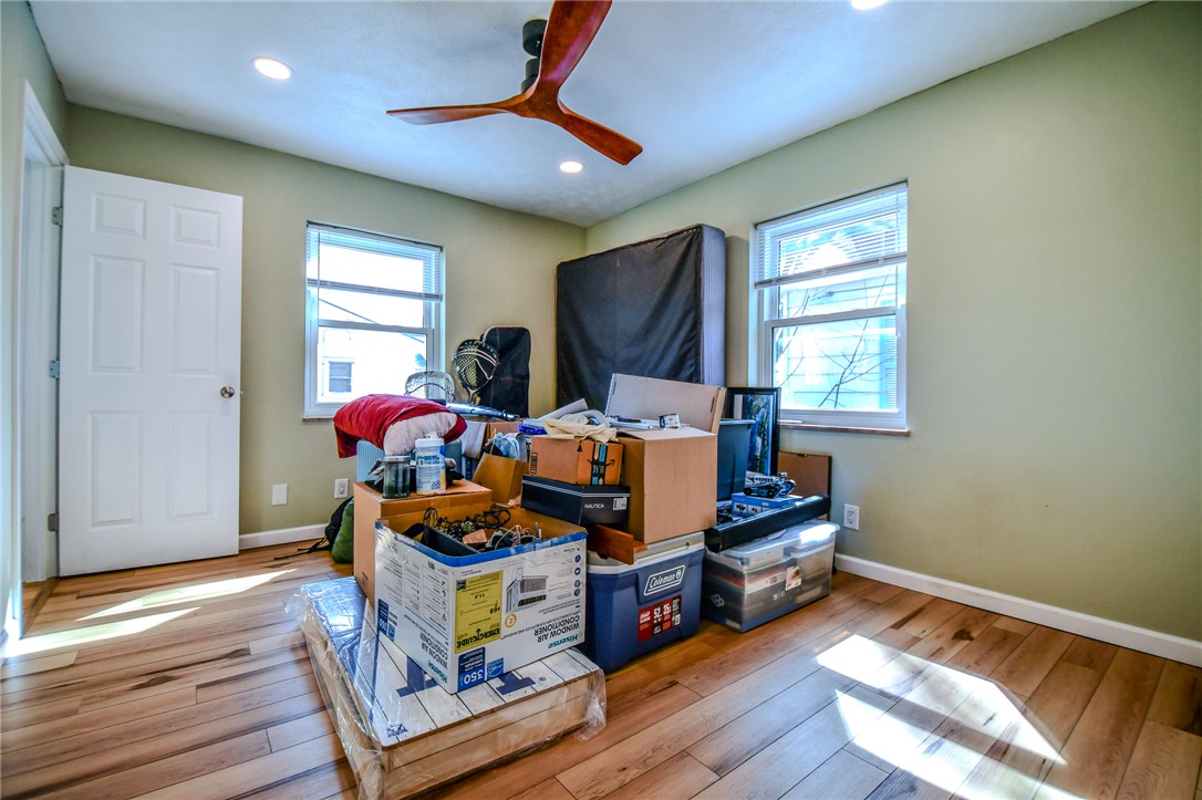 816 South Smithville Road Dayton, OH 45403 - Photo 19 of 33 This versatile room features warm wood flooring and ample natural light, ideal for various uses.