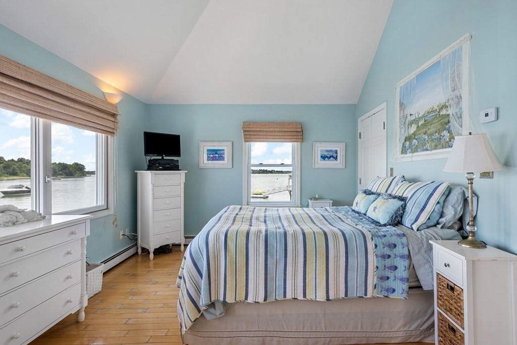225 Nantasket Road Hull, MA 02045 - Photo 24 of 40 a bedroom with a bed and large windows