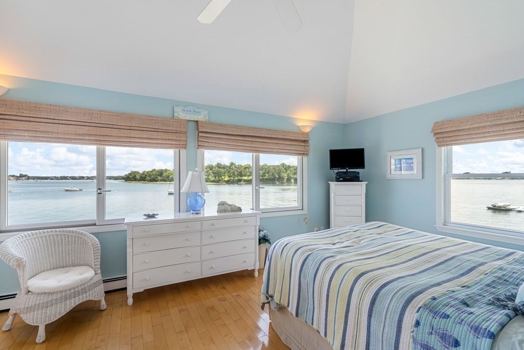 225 Nantasket Road Hull, MA 02045 - Photo 25 of 40 a bedroom with a bed and a large window