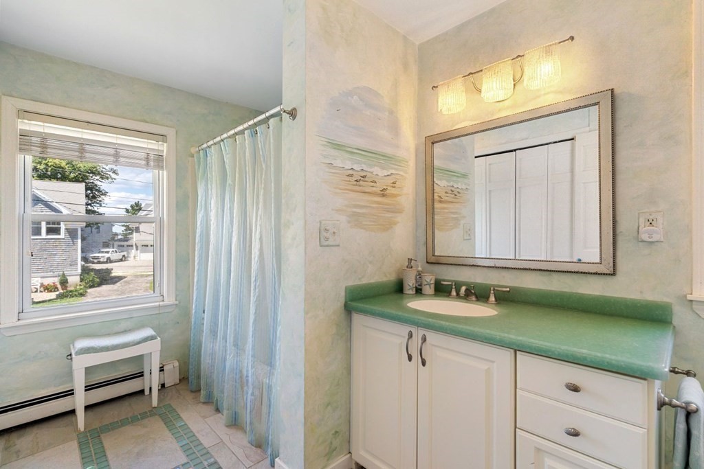 225 Nantasket Road Hull, MA 02045 - Photo 29 of 40 a bathroom with a sink and a mirror