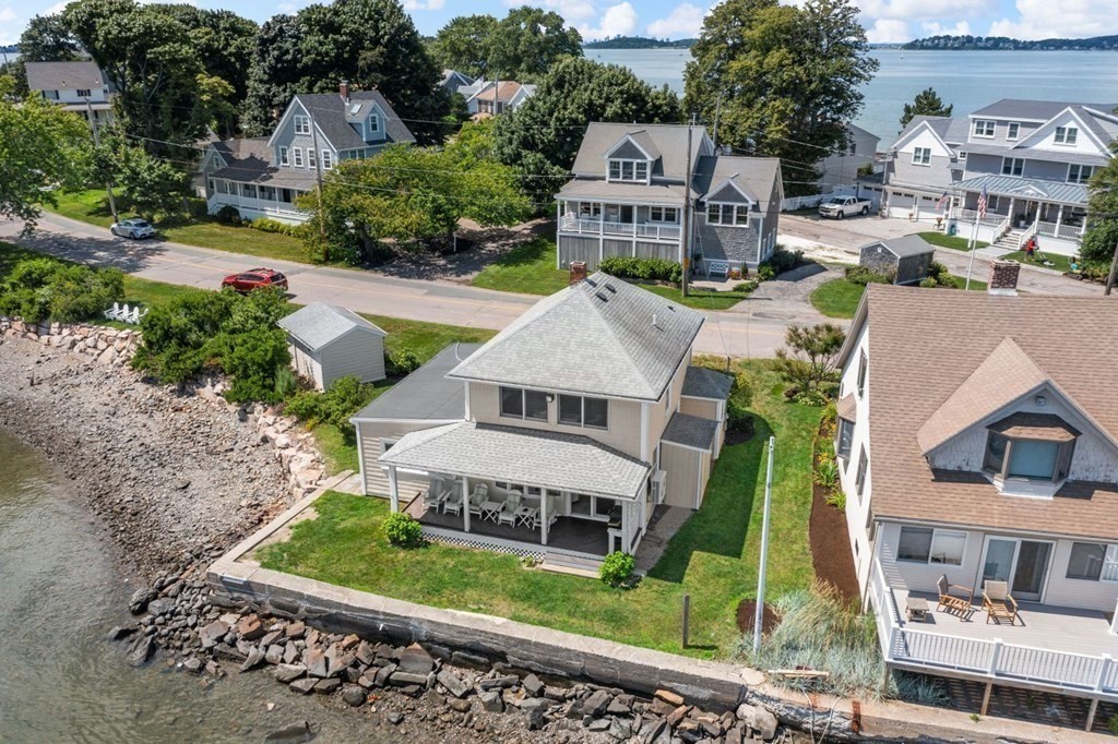 225 Nantasket Road Hull, MA 02045 - Photo 34 of 40 a view of a house with a yard and potted plants