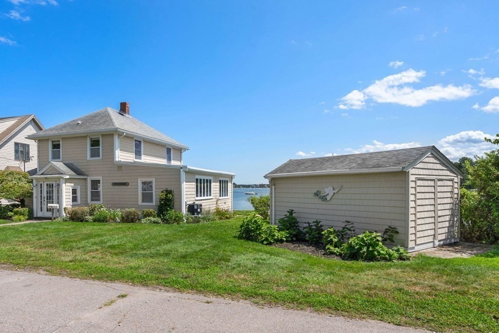 225 Nantasket Road Hull, MA 02045 - Photo 35 of 40 a front view of a house with a garden
