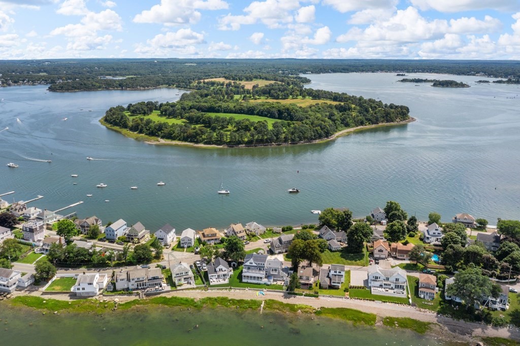 225 Nantasket Road Hull, MA 02045 - Photo 36 of 40 a view of a lake with a house in the background