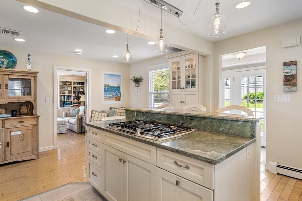 225 Nantasket Road Hull, MA 02045 - Photo 6 of 40 a kitchen with granite countertop stainless steel appliances a stove refrigerator and cabinets