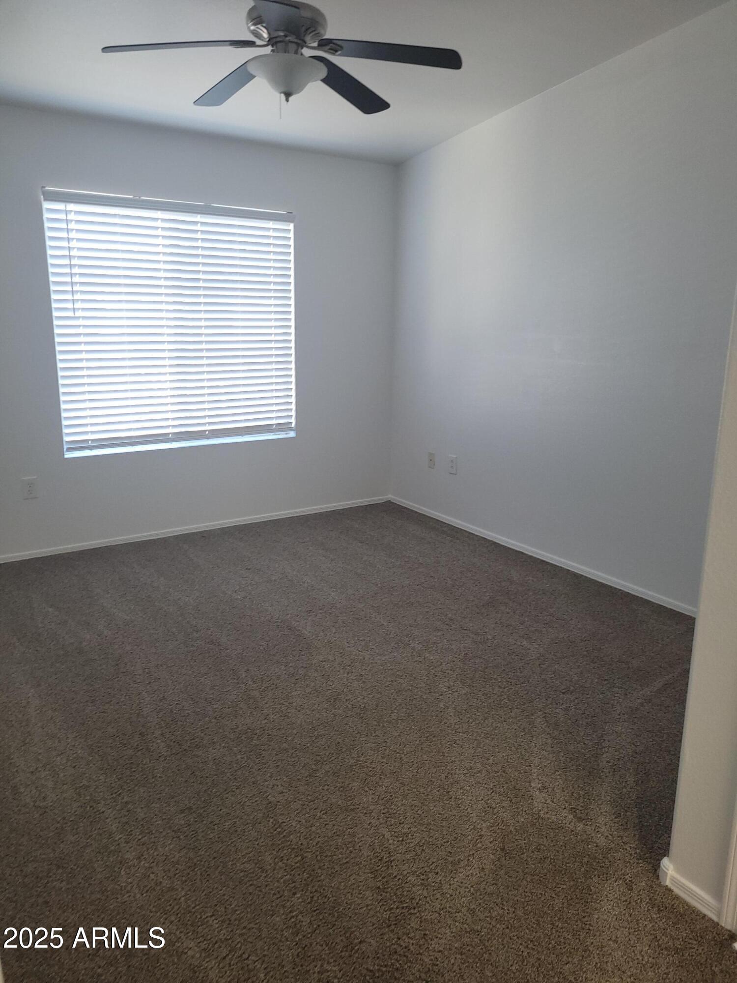 280 South Evergreen Road, Unit 1312 Tempe, AZ 85288 - Photo 15 of 25 an empty room with a window