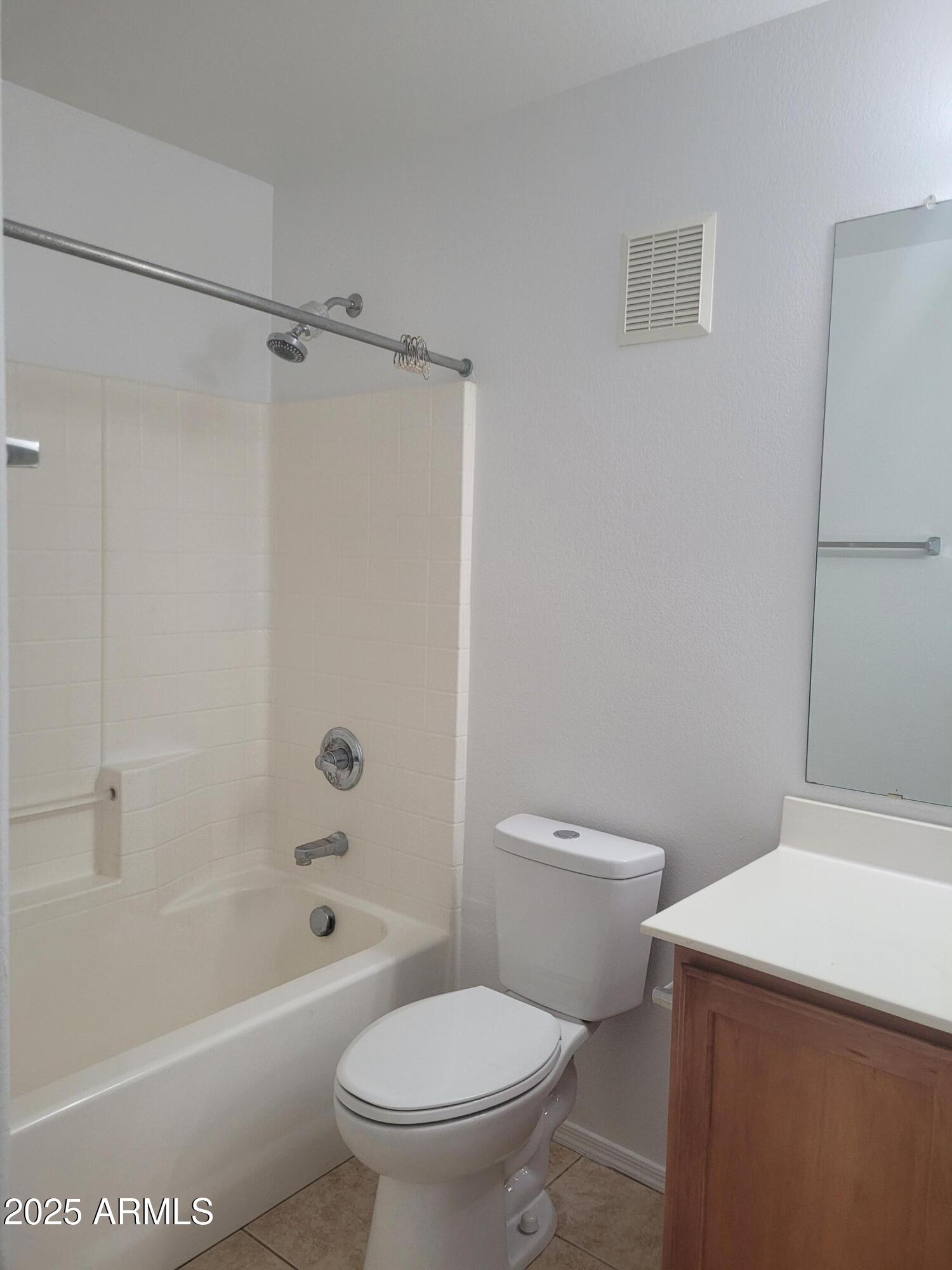 280 South Evergreen Road, Unit 1312 Tempe, AZ 85288 - Photo 18 of 25 a white toilet sitting next to a bath tub and a shower
