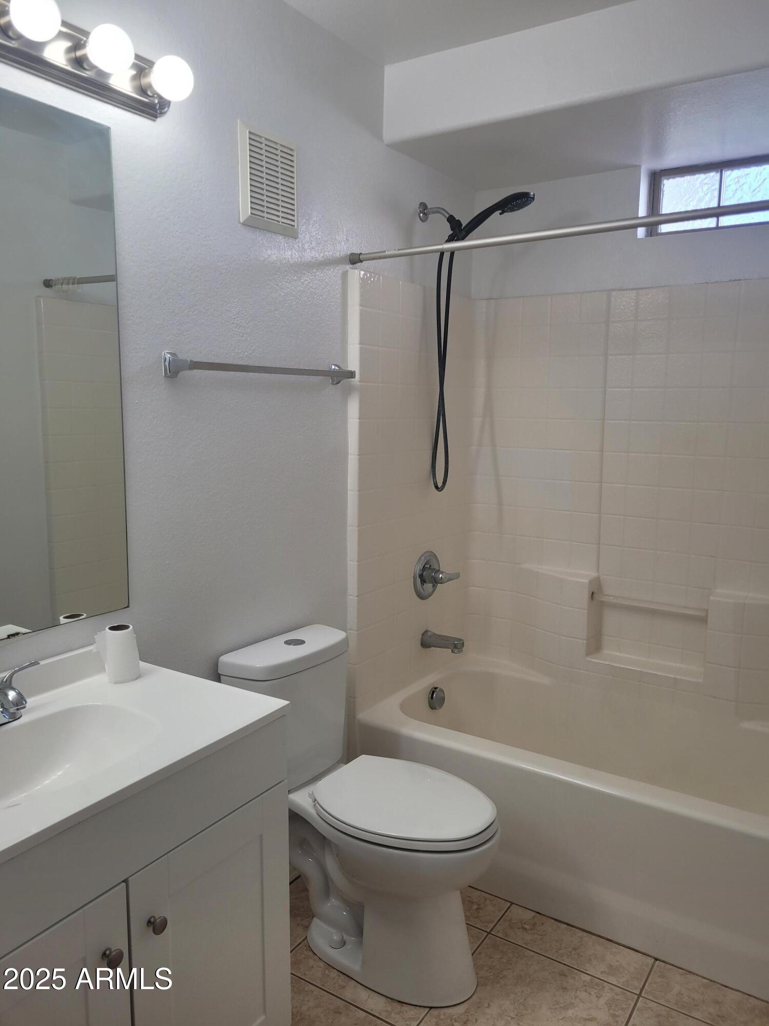 280 South Evergreen Road, Unit 1312 Tempe, AZ 85288 - Photo 22 of 25 a bathroom with a sink toilet and shower
