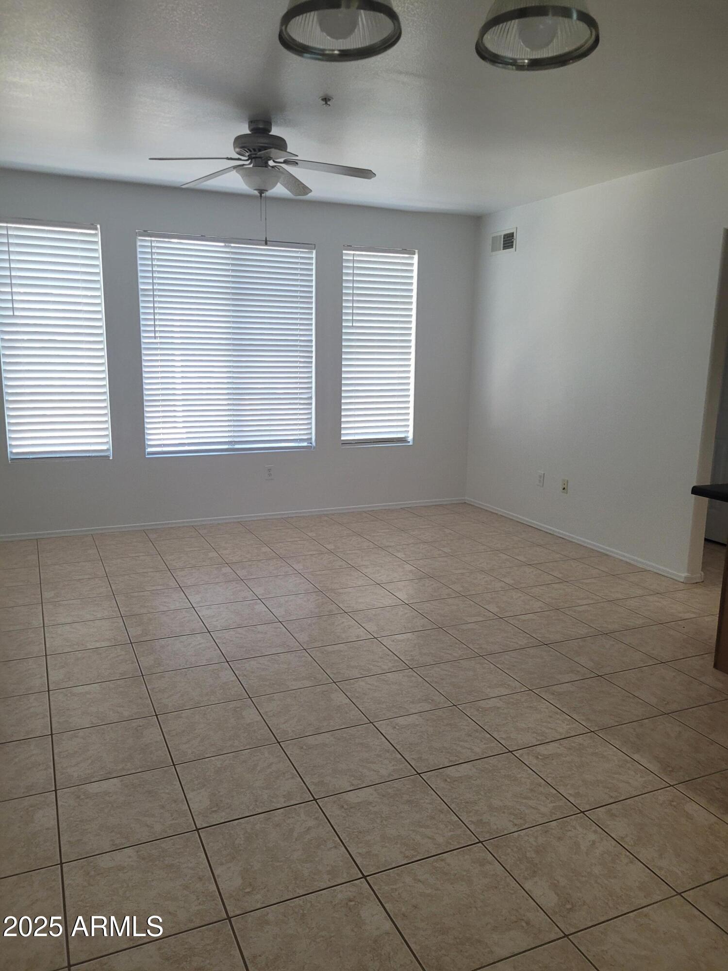 280 South Evergreen Road, Unit 1312 Tempe, AZ 85288 - Photo 8 of 25 a view of an empty room with a window