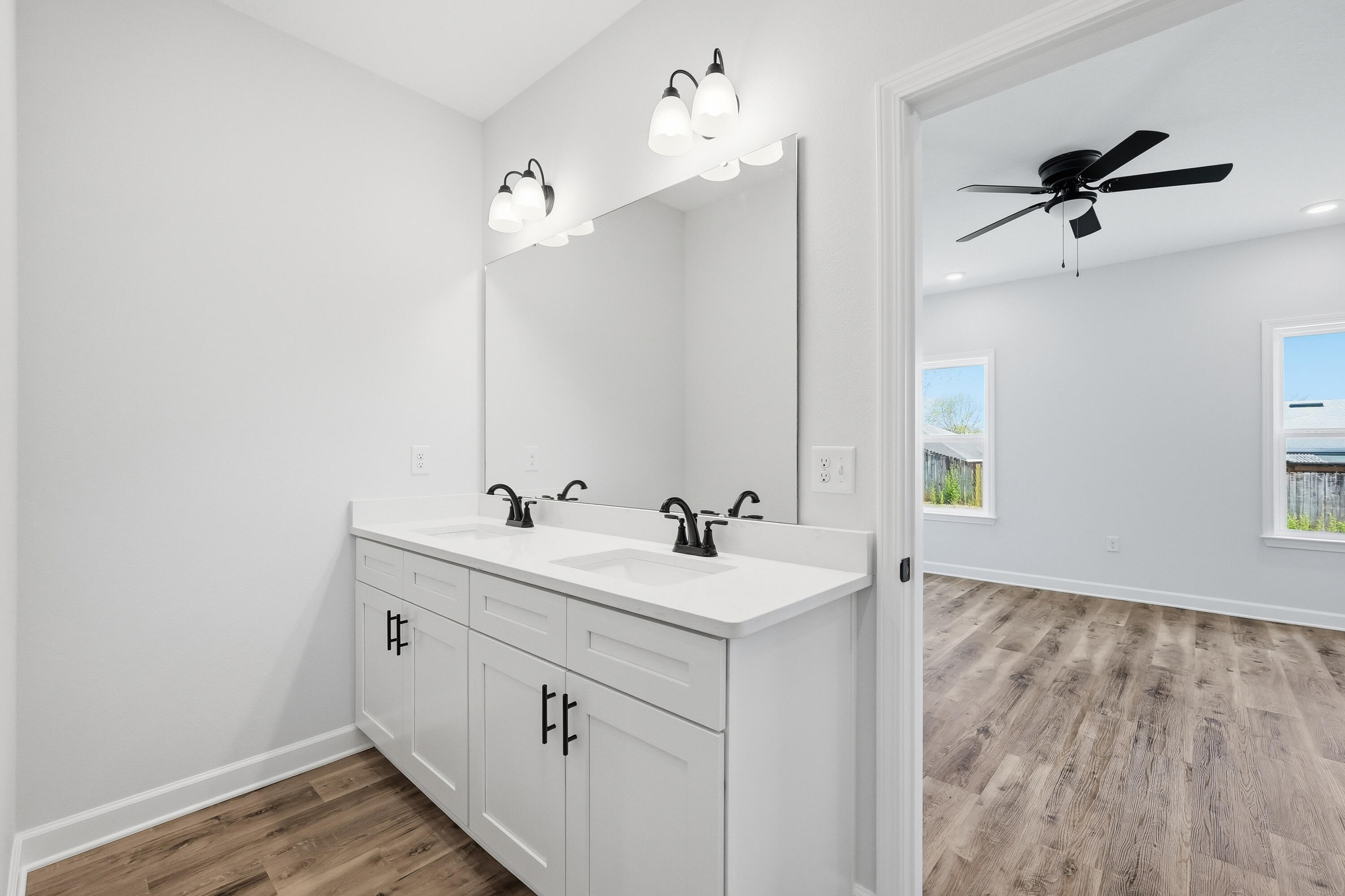 2801 Blackbird Court Crestview, FL 32539 - Photo 15 of 26 a bathroom with a sink and a mirror