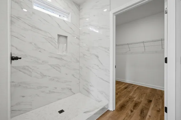 a bathroom with a bathtub and a shower