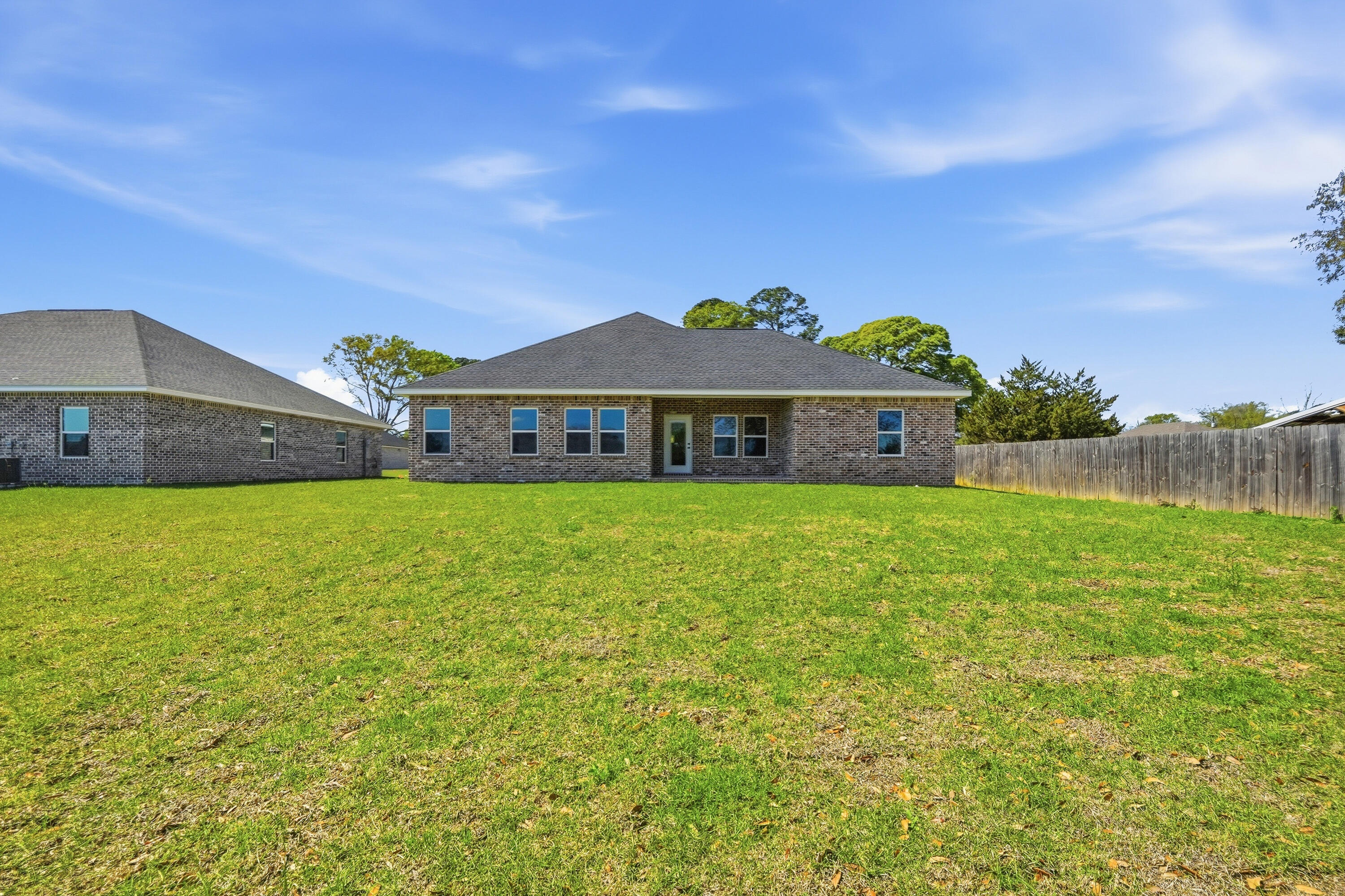 2801 Blackbird Court Crestview, FL 32539 - Photo 25 of 26 a front view of a house with a garden