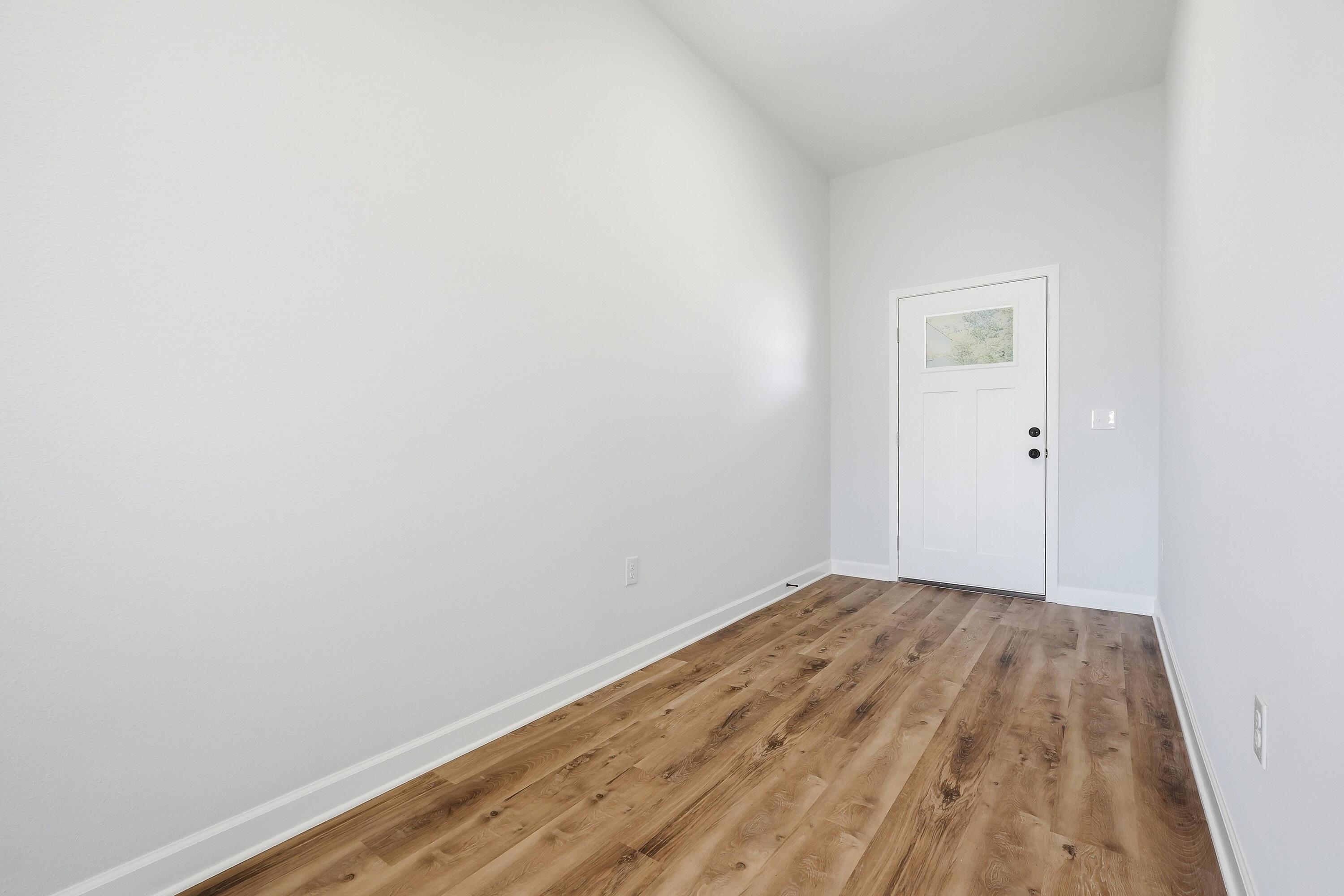 2801 Blackbird Court Crestview, FL 32539 - Photo 3 of 26 a view of a room with wooden floor and white walls