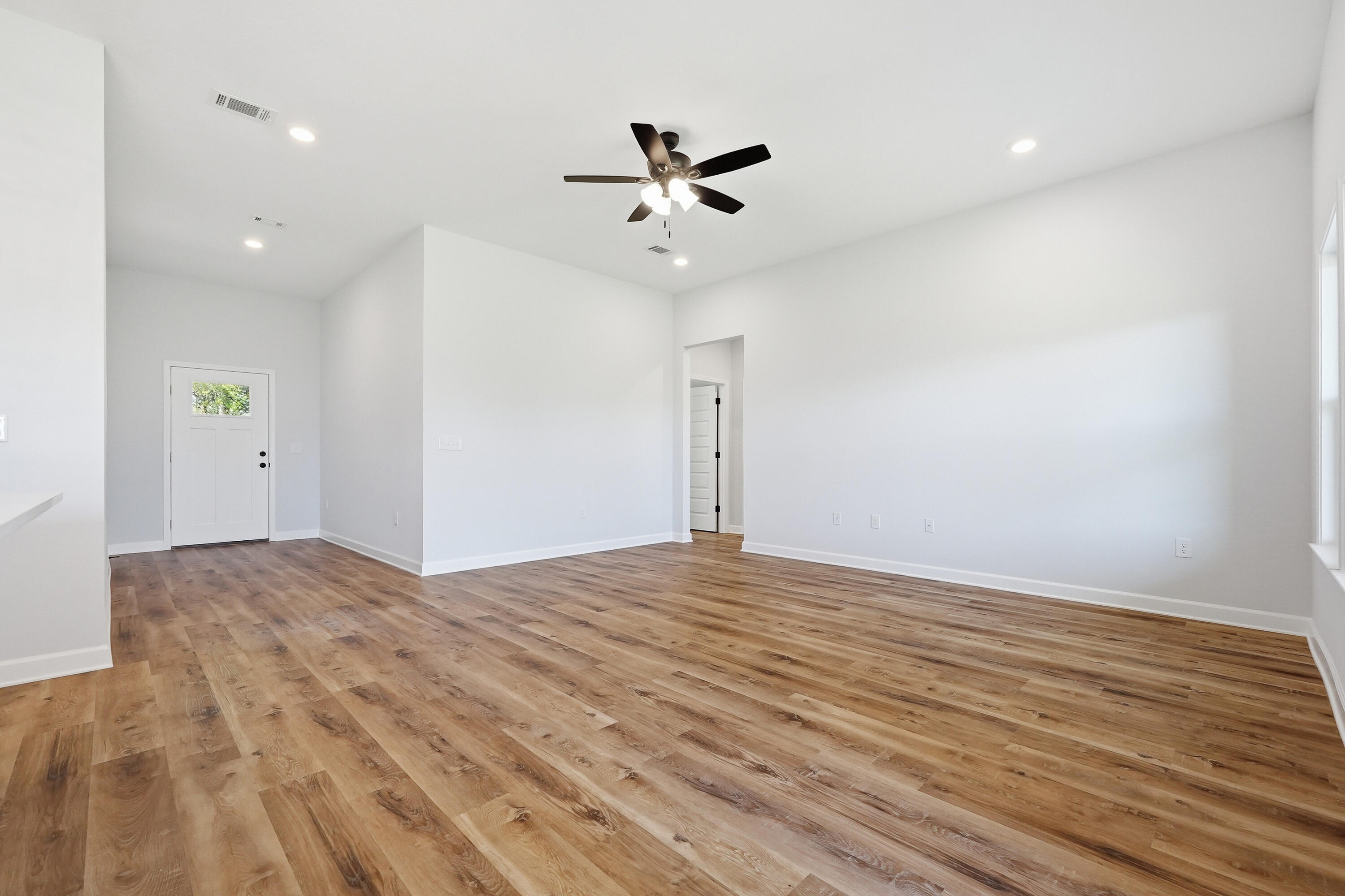 2801 Blackbird Court Crestview, FL 32539 - Photo 8 of 26 a view of empty room with wooden floor
