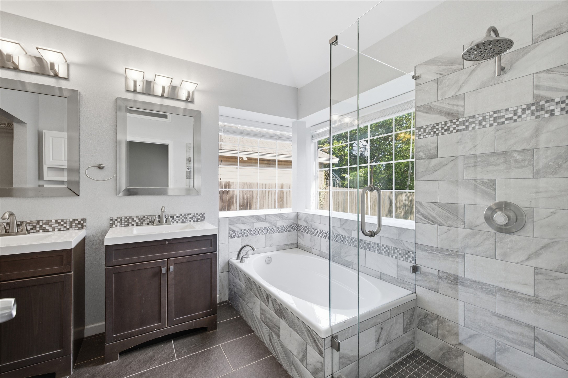 2922 Wickersham Lane Austin, TX 78741 - Photo 23 of 26 a bathroom with a tub sink and mirror