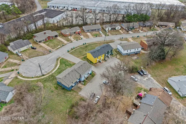 an aerial view of a house with outdoor space