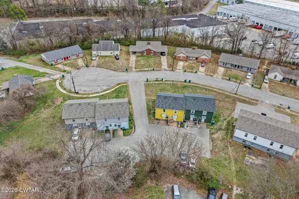 an aerial view of a house with outdoor space