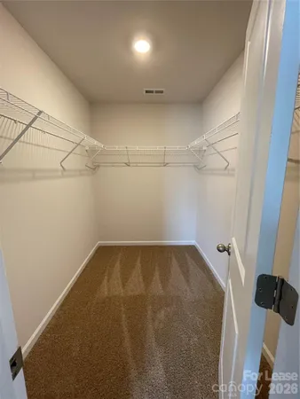 a view of a room with racks on the wall