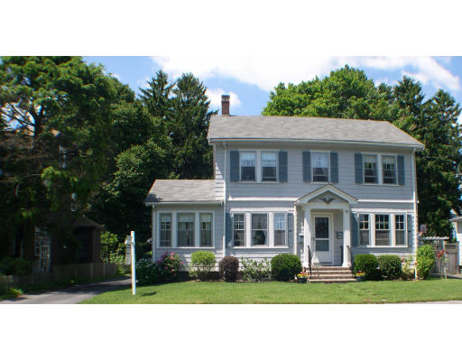 10 Lindbergh Road Marblehead, MA 01945 - Photo 1 of 1 a view of a yard in front of a brick house with plants and large trees