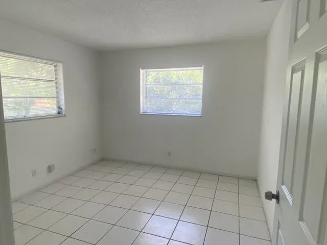 an empty room with windows