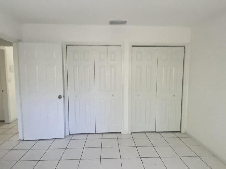 1718 Juno Road, Unit 2 North Palm Beach, FL 33408 - Photo 9 of 9 a view of a closet area