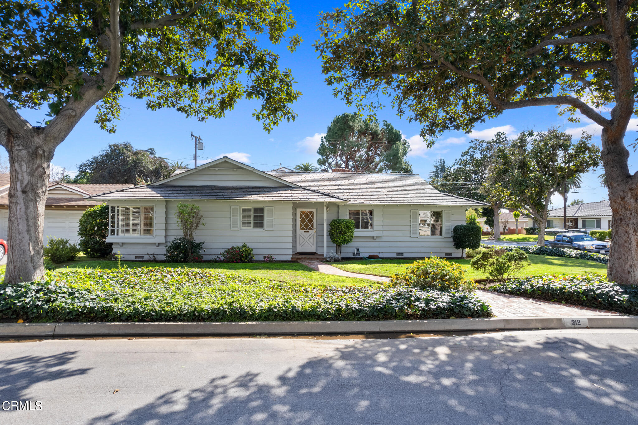 312 Coyle Avenue Arcadia, CA 91006 - Photo 1 of 1 a front view of a house with a garden and trees