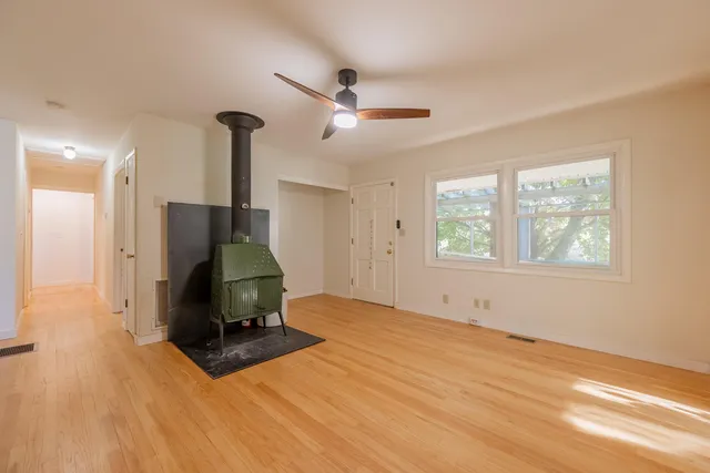 a room with a stove a sink and a refrigerator