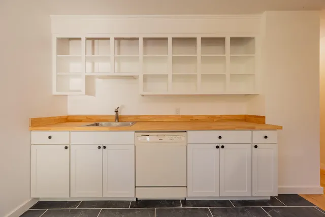 a front view of house with yard and seating area