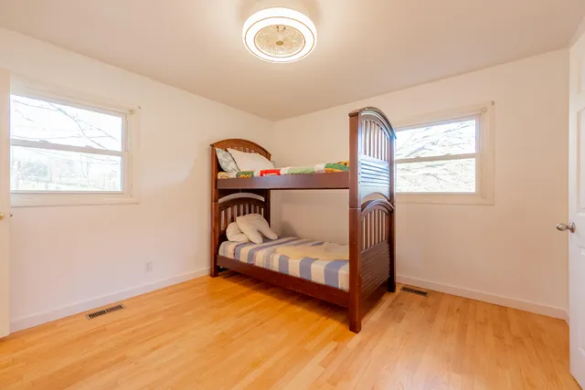 a view of a chairs and table on the wooden deck