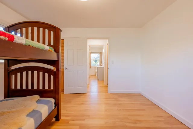 a view of a livingroom with furniture and a flat screen tv