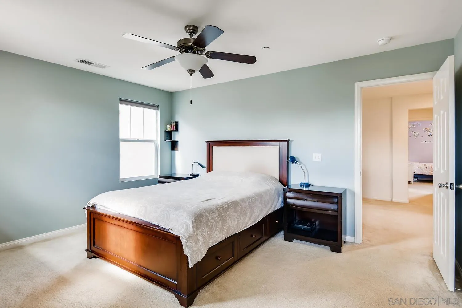 1223 Mason Road Chula Vista, CA 91913 - Photo 14 of 24 a spacious bedroom with a bed and window