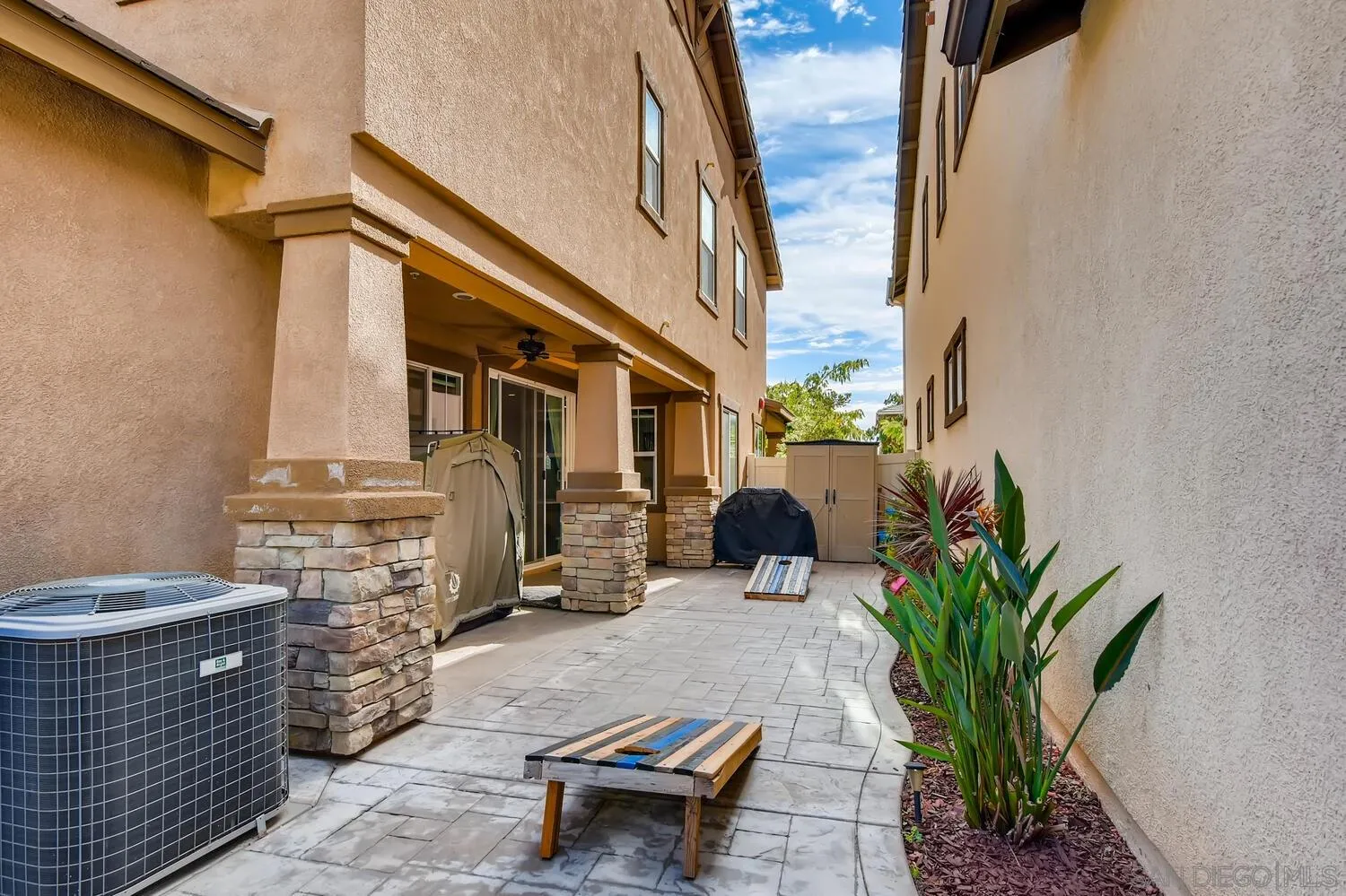 1223 Mason Road Chula Vista, CA 91913 - Photo 22 of 24 a view of a patio with table and chairs potted plants