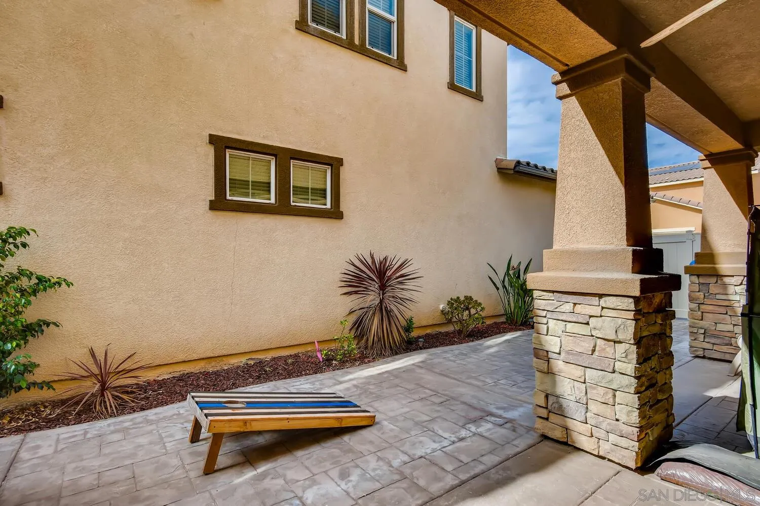 1223 Mason Road Chula Vista, CA 91913 - Photo 23 of 24 a backyard of a house with wooden fence and a bench