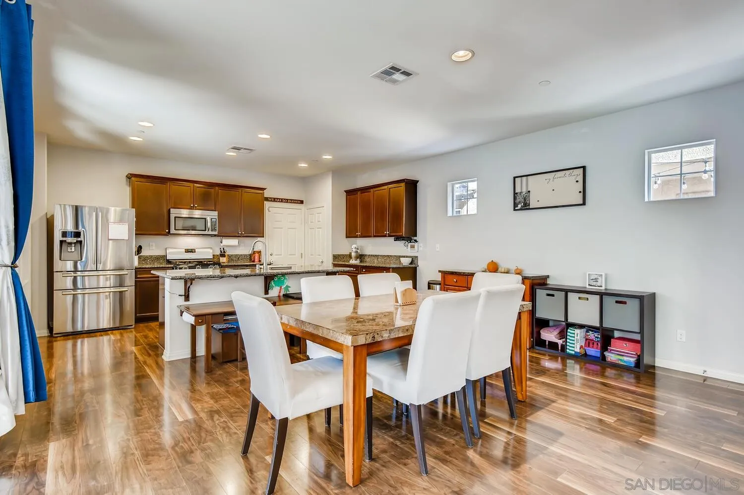 1223 Mason Road Chula Vista, CA 91913 - Photo 5 of 24 a view of a dining room with furniture and wooden floor
