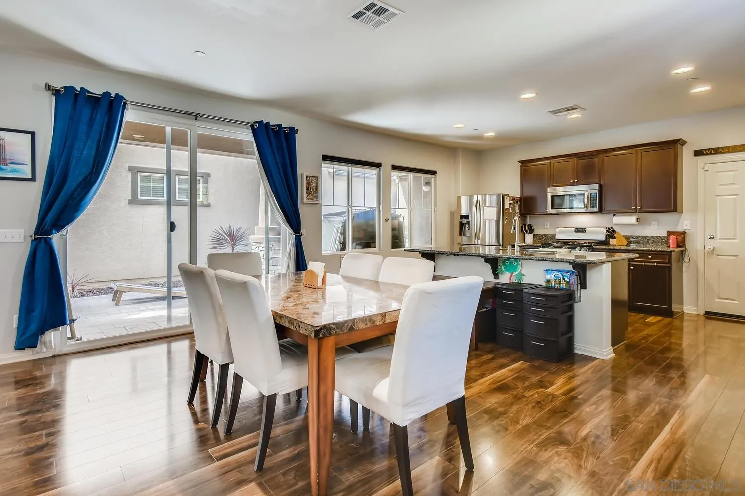 1223 Mason Road Chula Vista, CA 91913 - Photo 6 of 24 a view of a dining room with furniture window and wooden floor