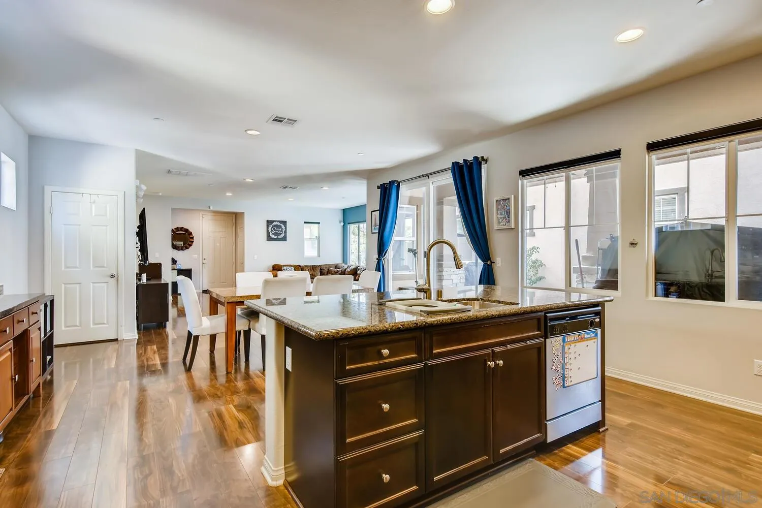 1223 Mason Road Chula Vista, CA 91913 - Photo 10 of 24 a view of a kitchen counter top space with furniture and wooden floor