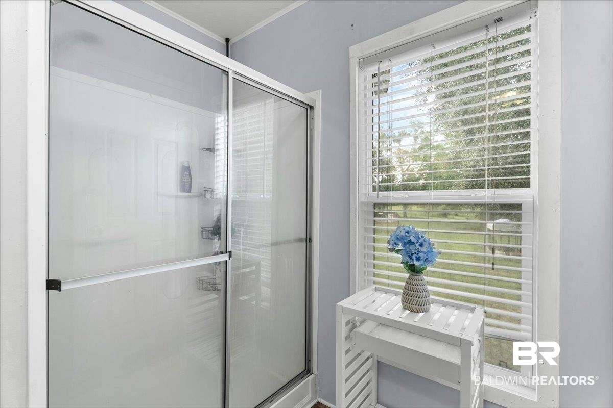 21011 River Road Robertsdale, AL 36567 - Photo 15 of 29 Shower enclosure with sliding glass doors and white panelling