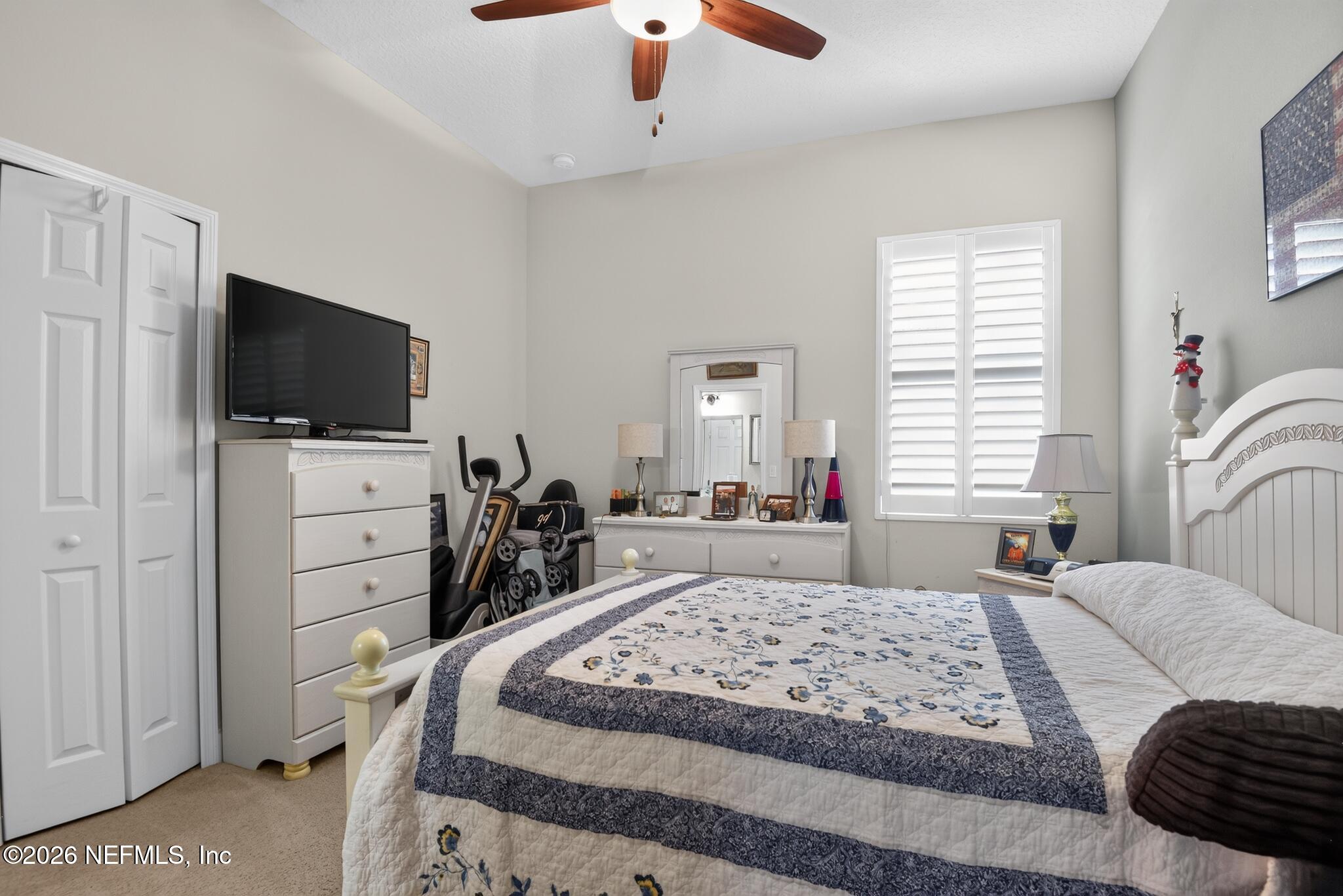 110 Vía Roma Ormond Beach, FL 32174 - Photo 28 of 43 a bedroom with a bed and a flat screen tv