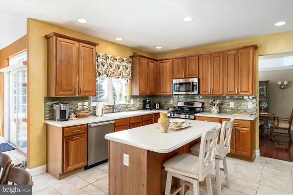 a kitchen with a sink stove and refrigerator