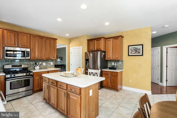 a kitchen with a sink and large window