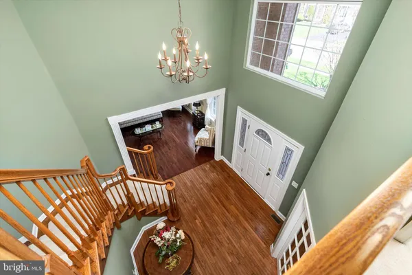 a bedroom with a bed a couch and window
