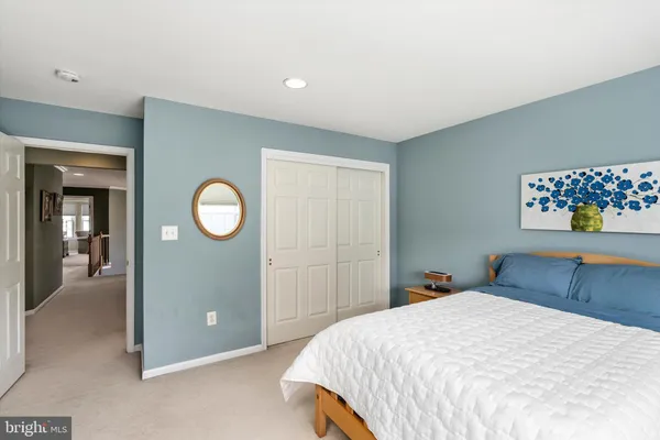 a bed room with a bed and a television