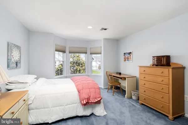 a bedroom with a bed and furniture