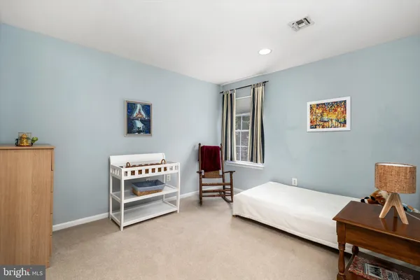 a living room with furniture and walk in closet
