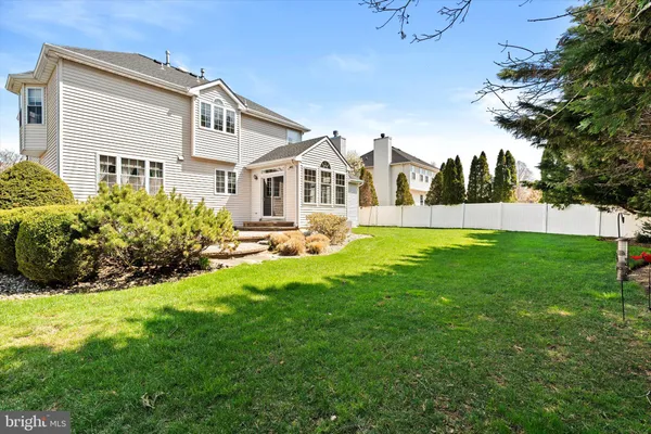 an aerial view of a house with a swimming pool yard and outdoor seating